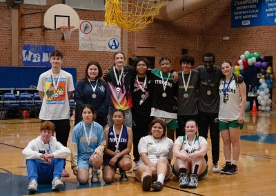 A photo of all of the WSBC MVP players, including the runner-ups and honorable mentions. There is a player representing each team in WSBC. The players are smiling widely with each of their individual WSBC medals hanging from their neck.